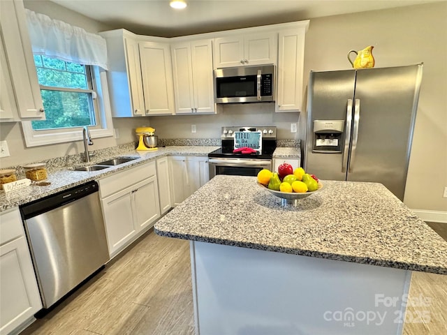 212 Old Centergrove Rd, Kannapolis, NC 28083 - kitchen featuring stainless steel appliances, light wood finished floors, white cabinets, and recessed lighting