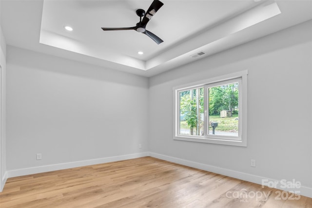 7 S Coulter Ave, Newton, NC 28658 - unfurnished room with a raised ceiling, light wood-type flooring, recessed lighting, and ceiling fan