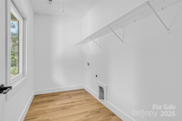 7 S Coulter Ave, Newton, NC 28658 - laundry room with electric dryer hookup, healthy amount of natural light, and light wood-type flooring