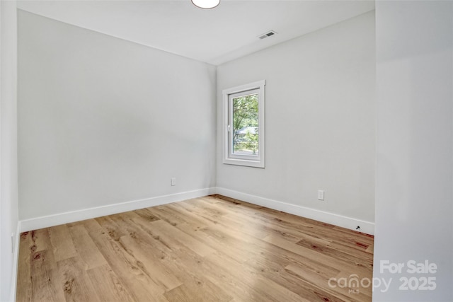 7 S Coulter Ave, Newton, NC 28658 - spare room featuring baseboards and wood finished floors