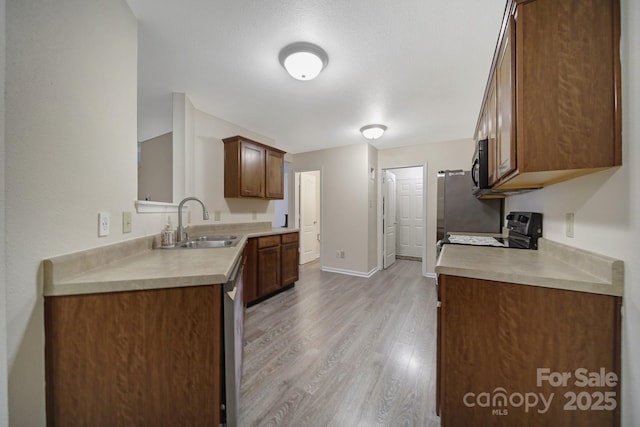 374 Morning Dew Dr, Concord, NC 28025 - kitchen with stainless steel appliances, light wood-style floors, and light countertops