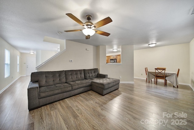 374 Morning Dew Dr, Concord, NC 28025 - living area featuring wood finished floors and ceiling fan
