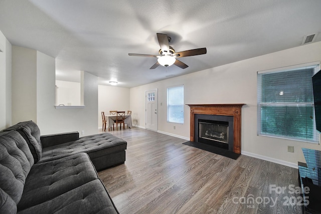374 Morning Dew Dr, Concord, NC 28025 - living room with ceiling fan, wood finished floors, and a fireplace with flush hearth