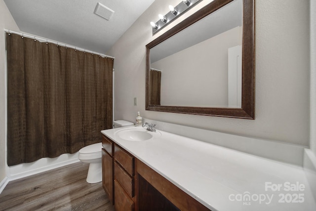374 Morning Dew Dr, Concord, NC 28025 - full bathroom featuring vanity, wood finished floors, and shower / tub combo with curtain