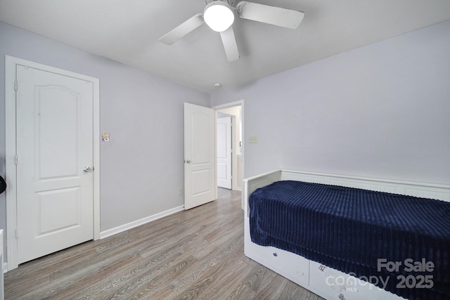 374 Morning Dew Dr, Concord, NC 28025 - unfurnished bedroom with wood finished floors and a ceiling fan