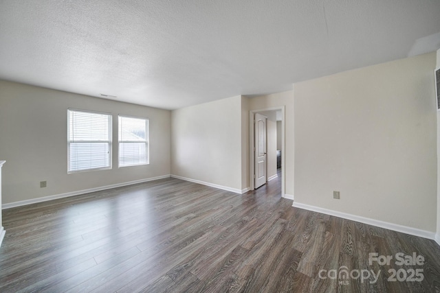 374 Morning Dew Dr, Concord, NC 28025 - empty room with dark wood-style floors and a textured ceiling