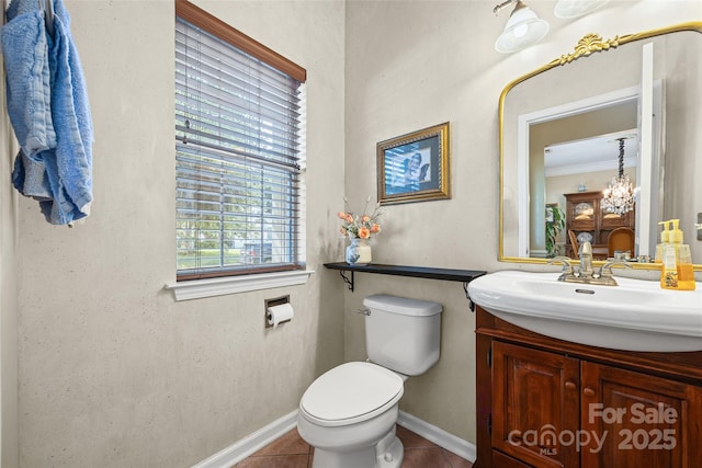7029 Scuppernong Ct, Charlotte, NC 28215 - bathroom featuring vanity, tile patterned floors, crown molding, and a chandelier