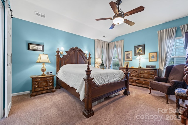7029 Scuppernong Ct, Charlotte, NC 28215 - carpeted bedroom featuring multiple windows, lofted ceiling, and ceiling fan