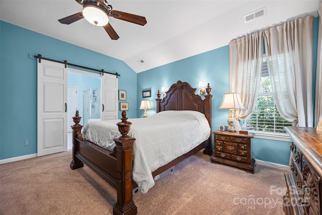 7029 Scuppernong Ct, Charlotte, NC 28215 - bedroom with carpet, vaulted ceiling, a barn door, and ceiling fan
