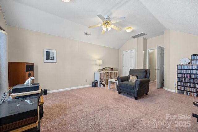7029 Scuppernong Ct, Charlotte, NC 28215 - living area featuring vaulted ceiling, a ceiling fan, and carpet flooring