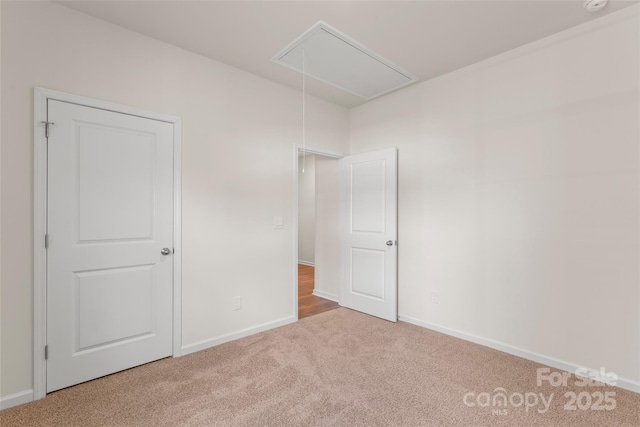 3505 Sycamore Crossing Ct, Mount Holly, NC 28120 - unfurnished bedroom featuring attic access and carpet floors