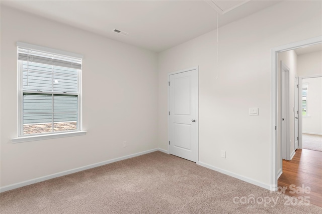 3505 Sycamore Crossing Ct, Mount Holly, NC 28120 - unfurnished bedroom featuring attic access and carpet floors