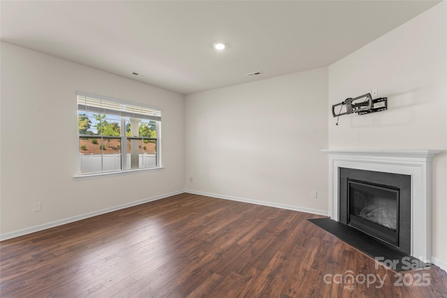 3505 Sycamore Crossing Ct, Mount Holly, NC 28120 - unfurnished living room featuring dark wood-style flooring, a fireplace with flush hearth, and recessed lighting