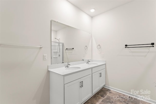 3505 Sycamore Crossing Ct, Mount Holly, NC 28120 - bathroom with double vanity and baseboards