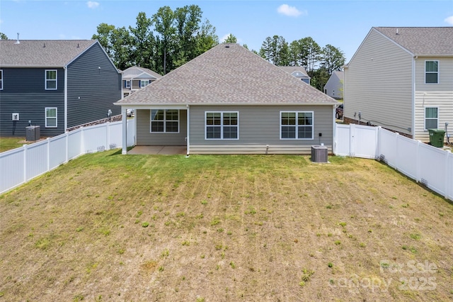 3505 Sycamore Crossing Ct, Mount Holly, NC 28120 - rear view of property featuring a fenced backyard, a patio area, and a shingled roof