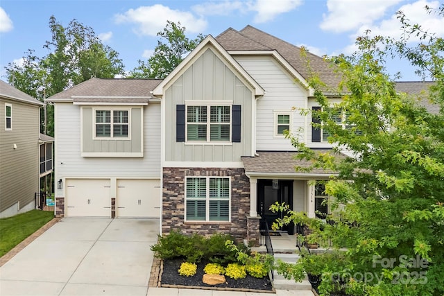 17514 Julees Walk Ln, Davidson, NC 28036 - craftsman-style house featuring board and batten siding, stone siding, driveway, an attached garage, and roof with shingles