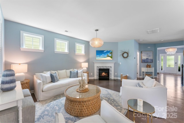17514 Julees Walk Ln, Davidson, NC 28036 - living area with plenty of natural light, wood finished floors, and a fireplace with flush hearth