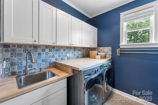 17514 Julees Walk Ln, Davidson, NC 28036 - laundry room featuring cabinet space, washing machine and clothes dryer, crown molding, and tile patterned floors