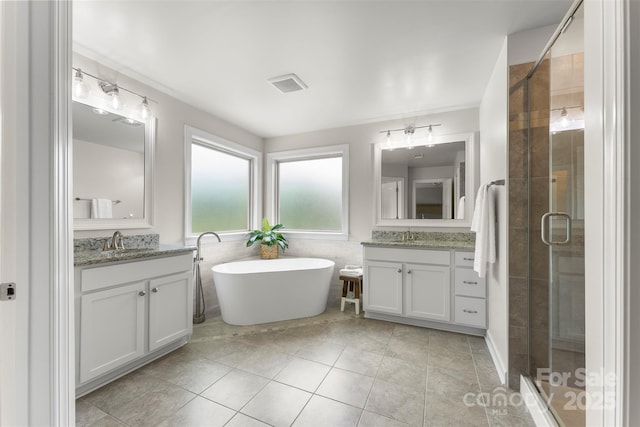 17514 Julees Walk Ln, Davidson, NC 28036 - full bath with two vanities, a stall shower, a soaking tub, and tile patterned flooring