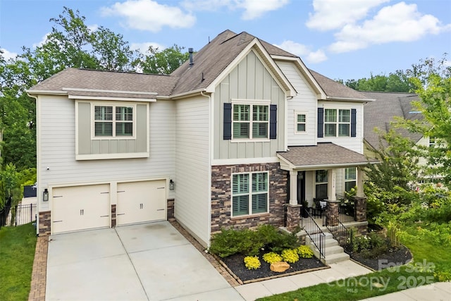17514 Julees Walk Ln, Davidson, NC 28036 - craftsman-style home featuring board and batten siding, stone siding, driveway, and an attached garage