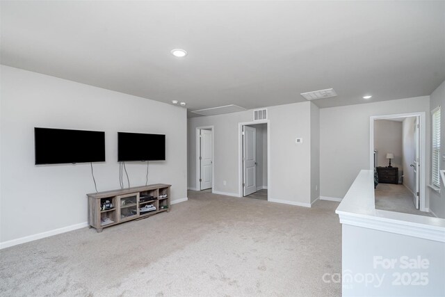 2014 Karen Woods Ln, Charlotte, NC 28216 - unfurnished living room featuring carpet floors, attic access, and recessed lighting