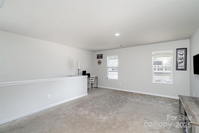 2014 Karen Woods Ln, Charlotte, NC 28216 - unfurnished living room featuring carpet floors and recessed lighting