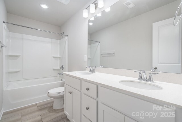2014 Karen Woods Ln, Charlotte, NC 28216 - bathroom with  shower combination, double vanity, recessed lighting, and wood finished floors