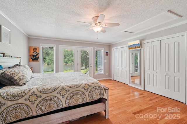 3770 Buck Point Rd, Catawba, NC 28609 - bedroom featuring a textured ceiling, ornamental molding, multiple closets, wood finished floors, and ceiling fan