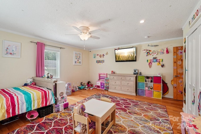 3770 Buck Point Rd, Catawba, NC 28609 - bedroom featuring crown molding, wood finished floors, a textured ceiling, and a ceiling fan