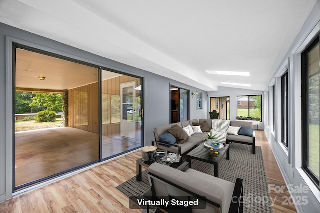 18 Progress Ln, Candler, NC 28715 - sunroom / solarium featuring wood finished floors, an outdoor living space, a skylight, and vaulted ceiling