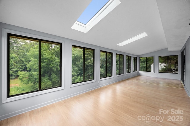 18 Progress Ln, Candler, NC 28715 - unfurnished sunroom featuring a skylight, lofted ceiling, and wood finished floors