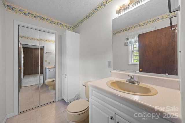18 Progress Ln, Candler, NC 28715 - bathroom featuring vanity and a textured ceiling