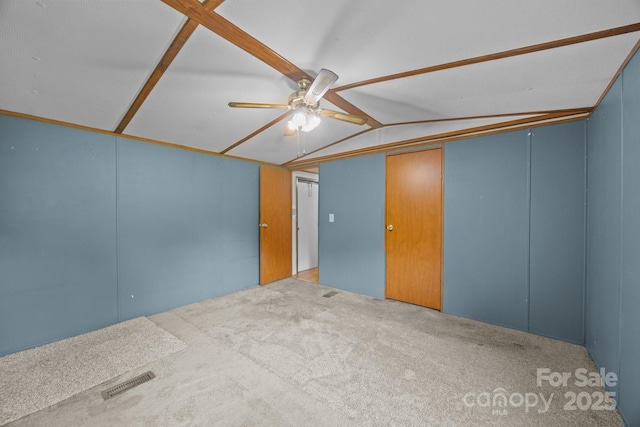 18 Progress Ln, Candler, NC 28715 - unfurnished room with lofted ceiling, a ceiling fan, and carpet flooring