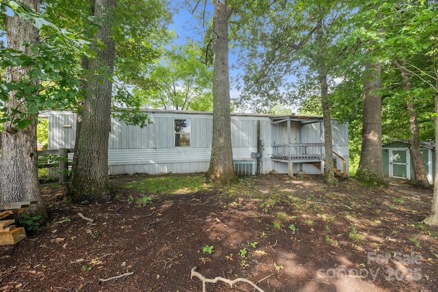 18 Progress Ln, Candler, NC 28715 - rear view of house featuring a storage unit
