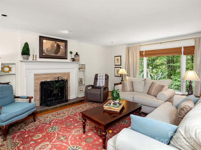 64 Wells Ln, Tryon, NC 28782 - living area with crown molding, a tiled fireplace, and wood finished floors