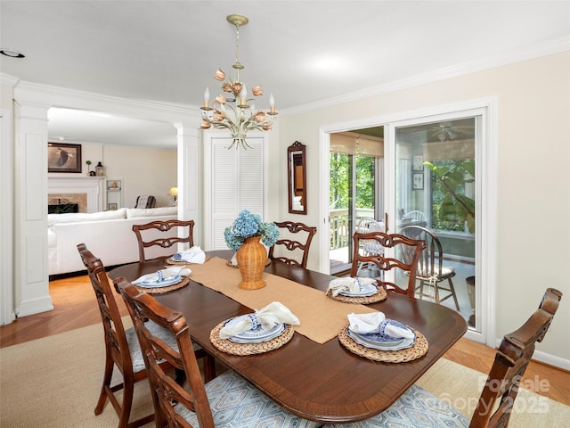 64 Wells Ln, Tryon, NC 28782 - dining space featuring ornamental molding, a chandelier, and a fireplace