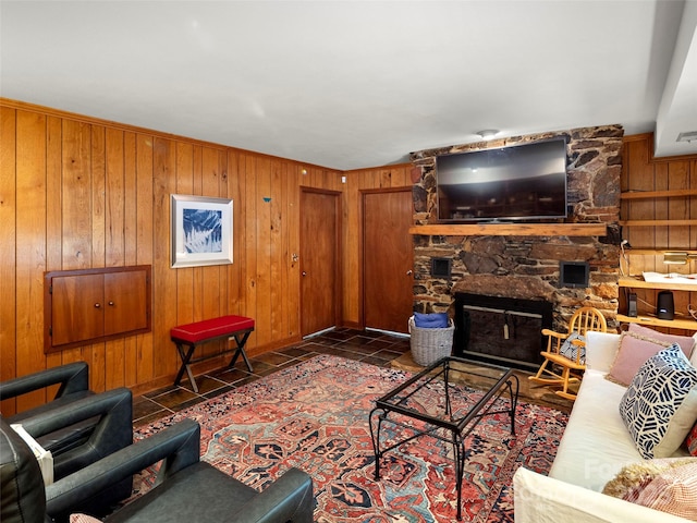 64 Wells Ln, Tryon, NC 28782 - tiled living area with wood walls and a stone fireplace