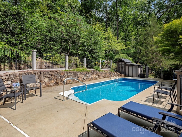 64 Wells Ln, Tryon, NC 28782 - view of pool featuring a patio area and a storage unit