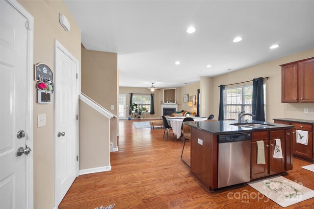 673 Stonehenge Dr, Rock Hill, SC 29730 - kitchen featuring stainless steel dishwasher, light wood-style floors, plenty of natural light, a kitchen island with sink, and recessed lighting