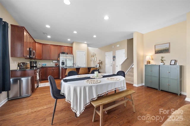 673 Stonehenge Dr, Rock Hill, SC 29730 - dining space featuring wood finished floors, recessed lighting, and stairs