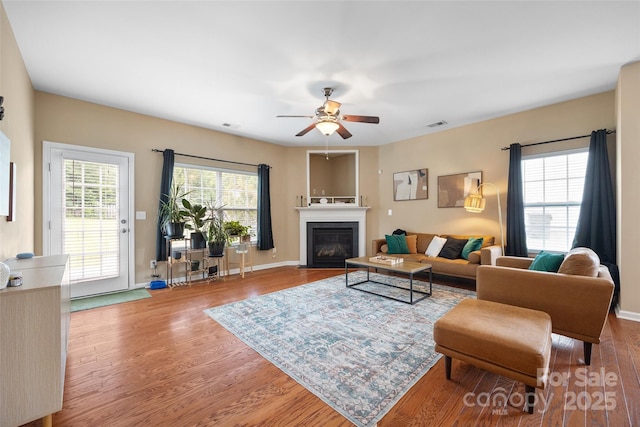 673 Stonehenge Dr, Rock Hill, SC 29730 - living room with wood finished floors, ceiling fan, and a fireplace with flush hearth