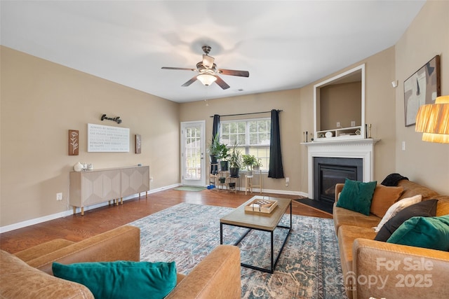 673 Stonehenge Dr, Rock Hill, SC 29730 - living area with a ceiling fan, wood finished floors, and a fireplace with flush hearth