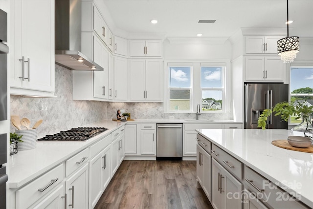 1106 Pomar Cir, Waxhaw, NC 28173 - kitchen featuring stainless steel appliances, wall chimney exhaust hood, dark wood-type flooring, pendant lighting, and tasteful backsplash