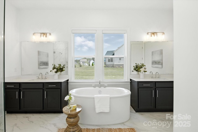 1106 Pomar Cir, Waxhaw, NC 28173 - full bathroom with marble finish flooring, two vanities, and a soaking tub