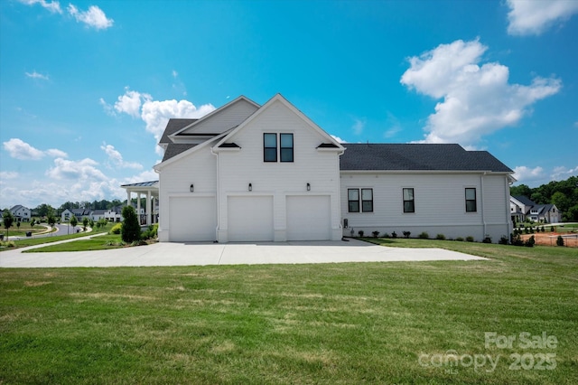 1106 Pomar Cir, Waxhaw, NC 28173 - back of property with a garage, driveway, and a lawn