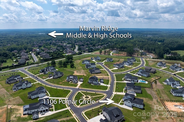 1106 Pomar Cir, Waxhaw, NC 28173 - aerial perspective of suburban area with a heavily wooded area