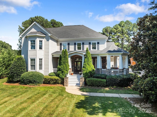 123 Yellow Jacket Cir, Mooresville, NC 28117 - view of front of home featuring a porch, a front yard, and a shingled roof