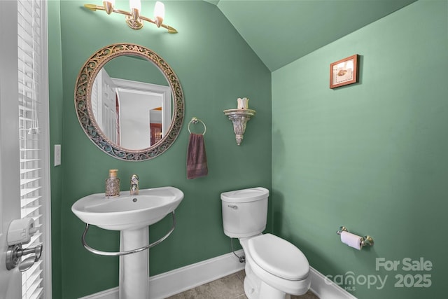 123 Yellow Jacket Cir, Mooresville, NC 28117 - half bathroom with lofted ceiling and tile patterned floors