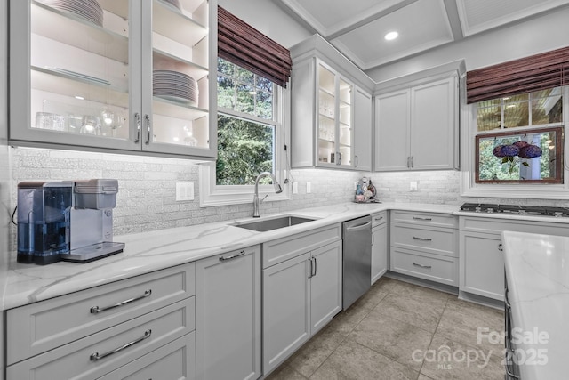 123 Yellow Jacket Cir, Mooresville, NC 28117 - kitchen with stainless steel appliances, decorative backsplash, light tile patterned floors, light stone counters, and glass insert cabinets