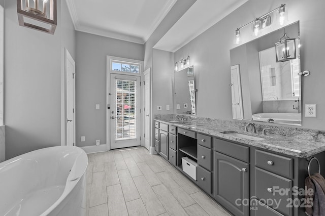 123 Yellow Jacket Cir, Mooresville, NC 28117 - bathroom featuring a freestanding bath, ornamental molding, and double vanity